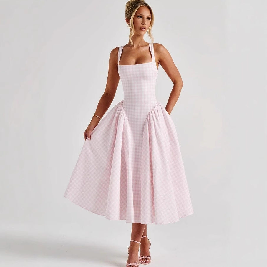 Halter neck with an expanded silhouette, a cinched waist and backless long dress