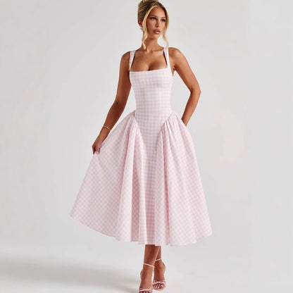 Halter neck with an expanded silhouette, a cinched waist and backless long dress