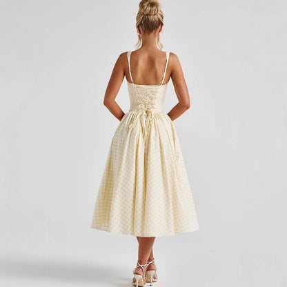 Halter neck with an expanded silhouette, a cinched waist and backless long dress