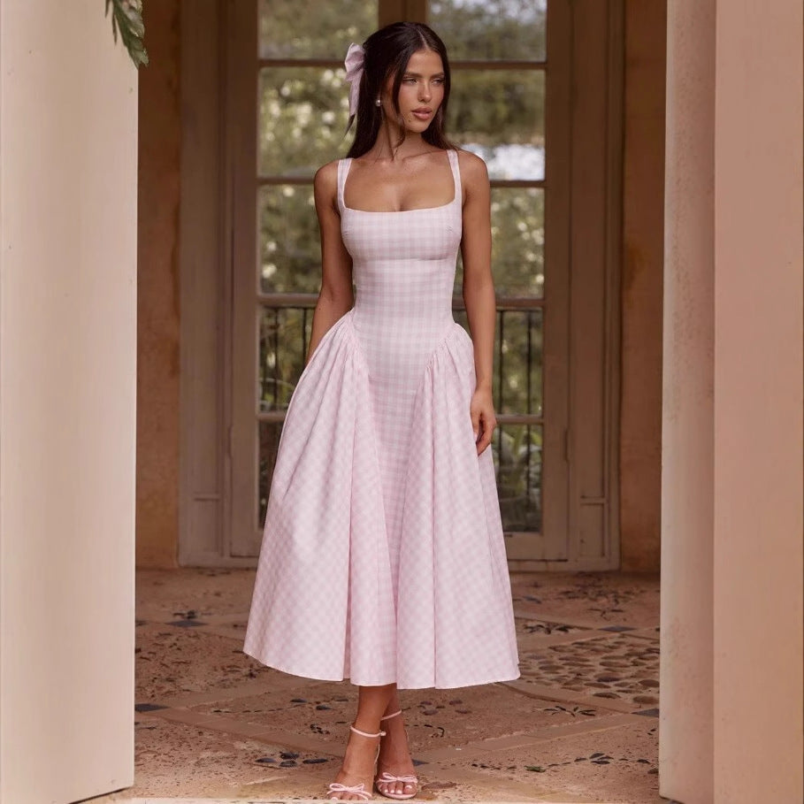 Halter neck with an expanded silhouette, a cinched waist and backless long dress